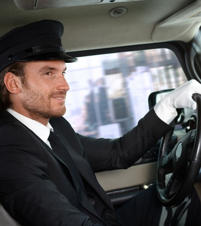 Luxury chauffeur driving a client through the city