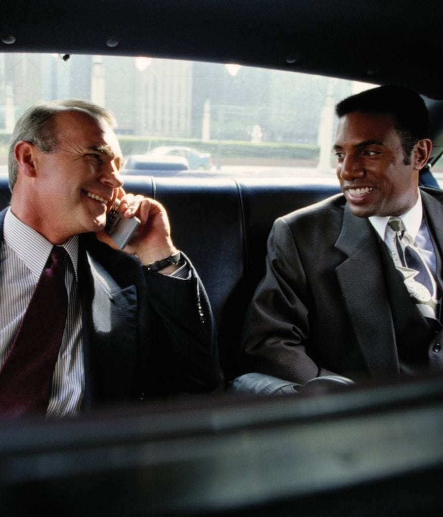 VIP Clients enjoying a conversation inside a luxury chauffeur vehicle