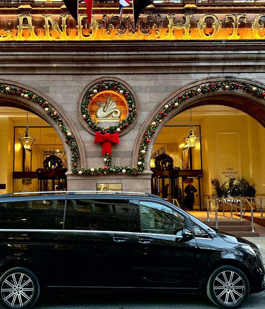A luxury chauffeur vehicle outside The Midland Hotel