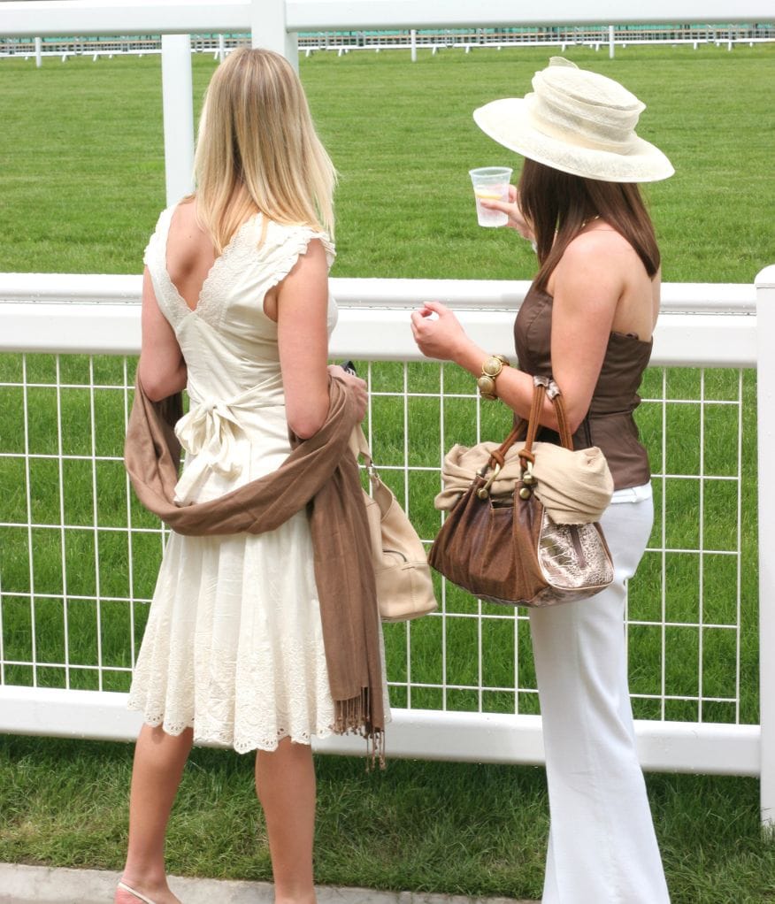 Two ladies enjoying the view at a sporting event
