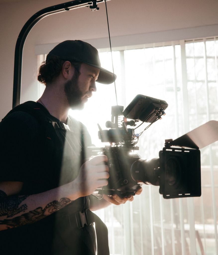 A videographer recording