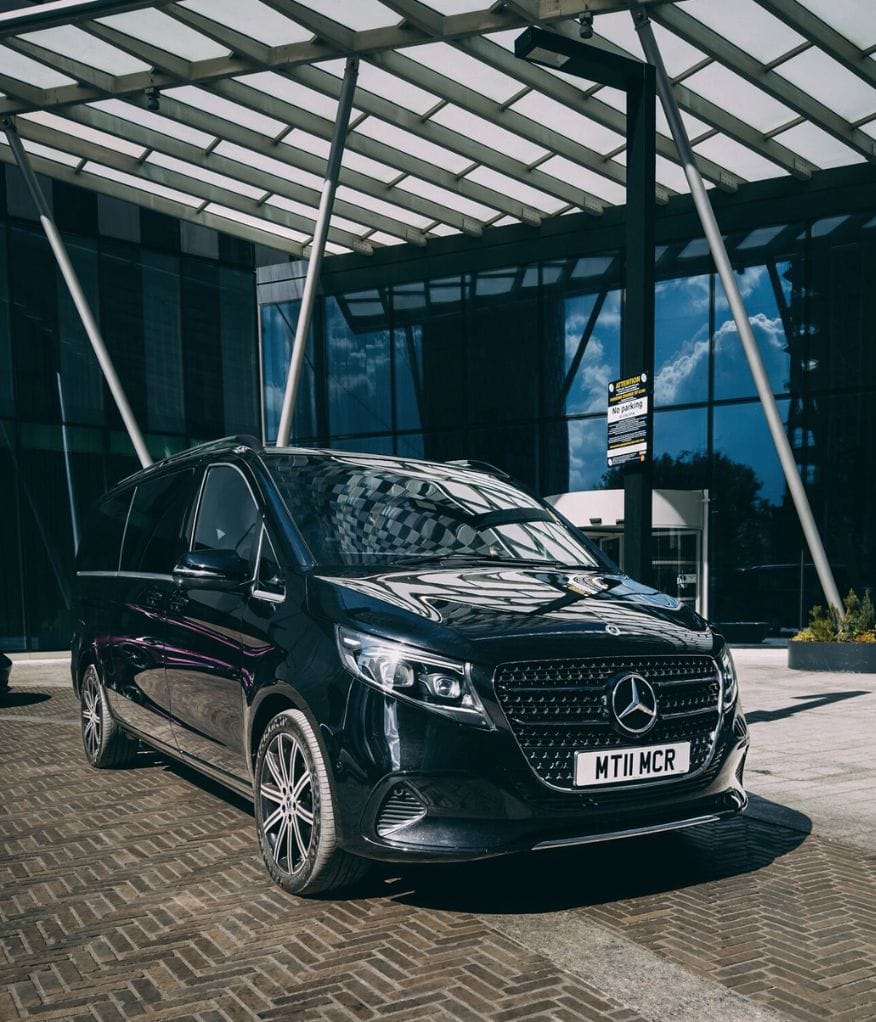 Chauffeur-driven car waiting outside to collect a client exiting a sporting event venue